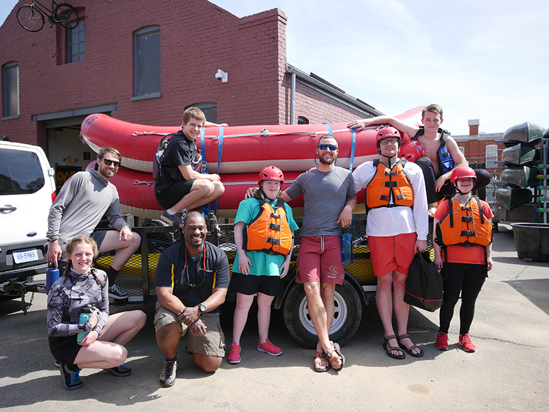 Group of ACE-IT students getting ready for a wwhite water trip.